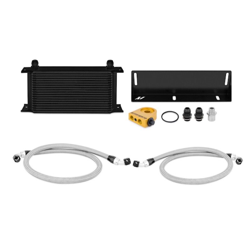 Close-up of Mishimoto Fox Body Mustang oil cooler core with bar-and-plate construction and AN Flare fittings